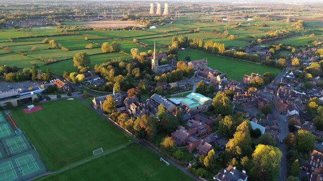 aerial view of Repton in Derbyshire, revealing the historic village layout, surrounding countryside, rooftops, roads, and green spaces within the rural English landscape