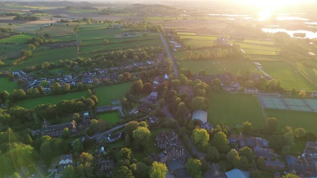 aerial view of Repton in Derbyshire, revealing the historic village layout, surrounding countryside, rooftops, roads, and green spaces within the rural English landscape