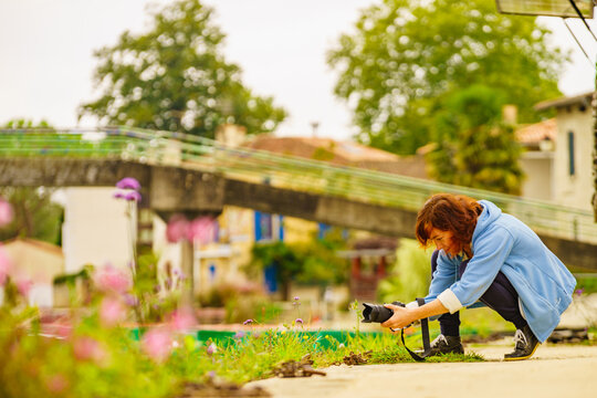 Woman take travel photo in Coulon France