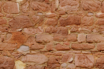 beautiful vintage texture of wall of medieval castle built in middle of 15th century, brown volumetric stones for designer, wallpaper, empty background, part of ancient building, monastery, temple