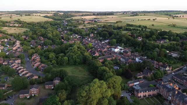aerial view of Repton in Derbyshire, revealing the historic village layout, surrounding countryside, rooftops, roads, and green spaces within the rural English landscape