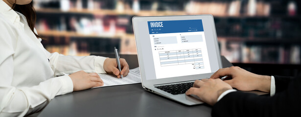 Invoice on computer screen from accounting application. Computer program for financial and budget of corporate business. brisk.