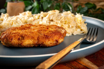 Minced meat cutlet with boiled sauerkraut.