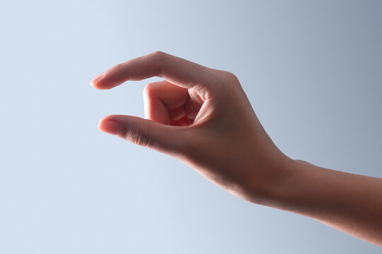 Hand Making Small Size Gesture Close-Up