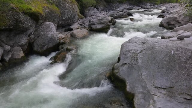 4K UHD Cinemagraph - seamless video loop of the mountain river Taugl close to the montain
