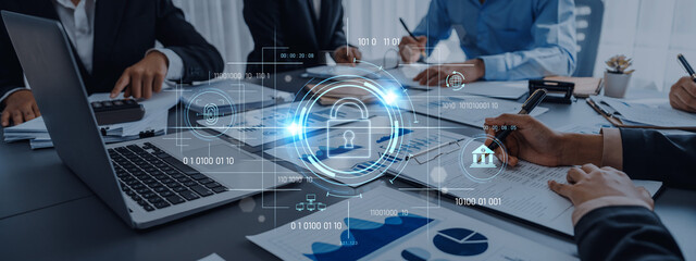 A dynamic business meeting focused on data security and technology solutions, highlighting graphs and a lock symbol to emphasize cybersecurity critical role in modern enterprises. Trope