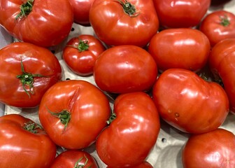 Red tomatoes in the store shop market supermarket
