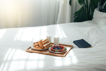 Breakfast in Bed with Pastries and Fresh Berries