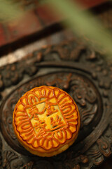 Golden Mooncake on Ornate Plate, Mid-Autumn Festival
