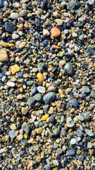 Wet stones af the beach of La Herradura, Spain