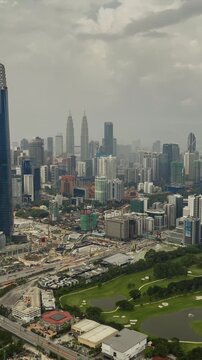 day time kuala lumpur city center mega construction traffic road aerial vertical panorama 4k timelapse malaysia