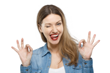 Playful woman winking and making OK gesture with both hands