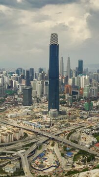 day time kuala lumpur city center mega construction traffic road aerial vertical panorama 4k timelapse malaysia