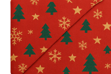 Christmas wrapping paper showing a festive pattern with green trees, golden stars, and snowflakes on red background, transparent edge