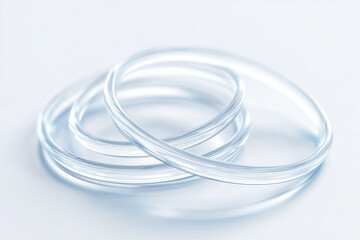 Fototapeta premium Transparent silicone tubes in loop shape on white background 