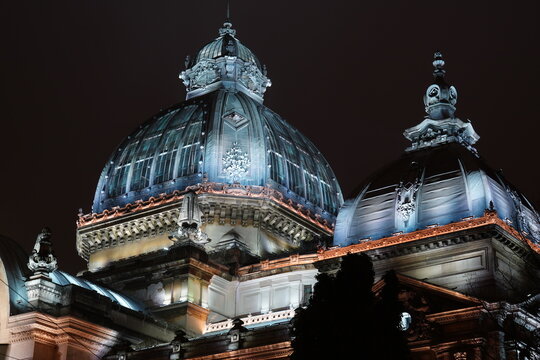 Beautiful dome roof in Renaissance architectural style of CEC Palace historical building on Calea Victoriei boulevard in Bucharest, at night