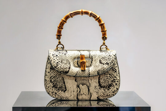 Nice, France - August 2, 2025: Iconic Gucci Bamboo handbag displayed in a luxury fashion store window, featuring the signature bamboo handle and textured leather design