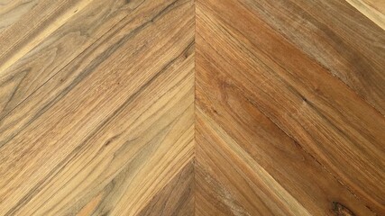 Female hand picking up a used injection needle cap and alcohol pad from a wooden table for disposal. 