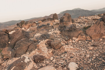 Mars-like volcanic rocky landscape on Fuerteventura, Canary Islands, barren stone terrain, mineral textures and arid wilderness under clear blue sky