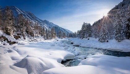 frozen river meanders through alpine canyon under fresh snow