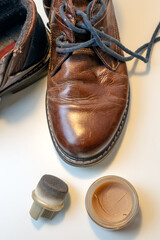 Cleaning Brown Leather Shoes with Brush &ndash; Footwear Care, Shoe Maintenance and Polishing at Home, Mens Style and Grooming Concept