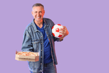 Male sports fan with soccer ball and pizza on lilac background