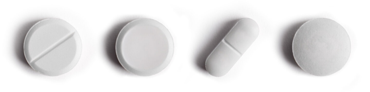 Collection of white medical pills isolated on white background. Medicines, Pills, and Capsules. Medical, healthcare, pharmaceutical and chemical concepts.