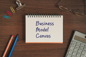 There is notebook with the word Business Model Canvas. It is as an eye-catching image.