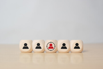 Customer relationship management (CRM), Target customer, buyer persona, marketing segmentation, job recruitment concept. Wooden cube blocks with focused on target customer symbols.