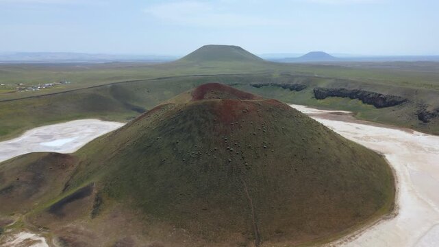 Drone aerial view of Lake Meke drying volcanic crater lake with red landscape in Turkey