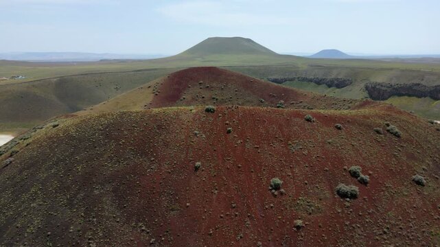 Drone aerial view of Lake Meke drying volcanic crater lake with red landscape in Turkey