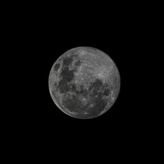 A high-resolution, detailed view of the full moon against the blackness of space, showcasing craters and lunar maria. Perfect for space and astronomy projects.