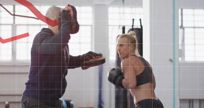 Trainer moving mitts athlete throwing punches ducking and boxing combos with gloves grid red graph