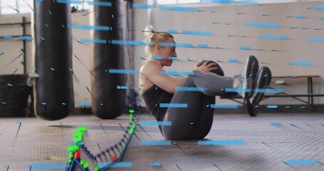Woman performing Russian twists in gym for fitness, medicine ball rotation initiating data graphs - Powered by Adobe