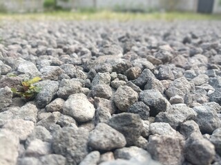 A closeup abstract pattern of rough black granite stones creating a natural texture surface