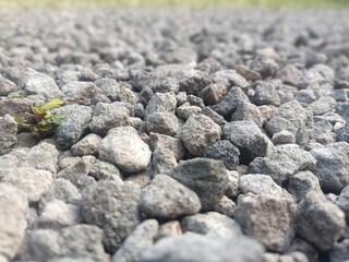 Close-up abstract texture of rough natural black granite rock surface wall pattern