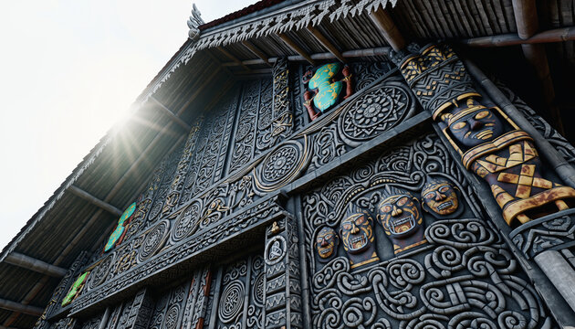 Intricate Maori Carvings Adorn Traditional Meeting House Facade Under Sunlight.