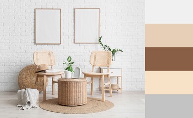 Interior of living room with chairs, houseplants and wicker table near white brick wall. Different color patterns