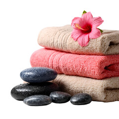 Spa towels and hot stones with a pink flower for relaxation