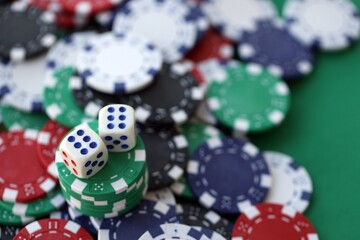 Dice game on the poker table in the casino. A successful combination of dice brought a lot of winning chips