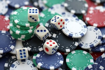Dice game on the poker table in the casino. A successful combination of dice brought a lot of winning chips