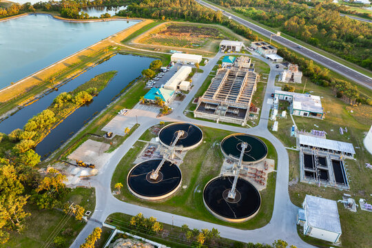Industrial water treatment facility with water cleaning cisterns and piping system