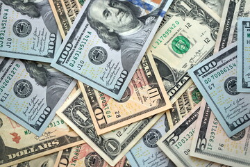 Big amount of different dollar bills close up. Hundred fifty twenty ten and five dollar banknotes