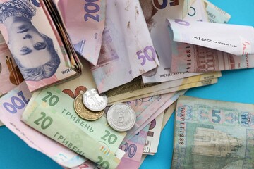 Big amount of different Ukrainian hryvnia money bills. Pile of crumpled ukrainian banknotes