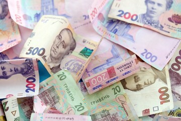 Big amount of different Ukrainian hryvnia money bills. Pile of crumpled ukrainian banknotes