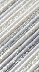 Silver and white metallic thread arrangement with diagonal lines