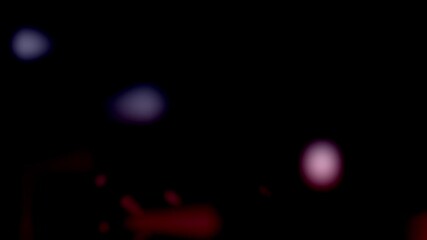 Blurry red and blue lights against dark background