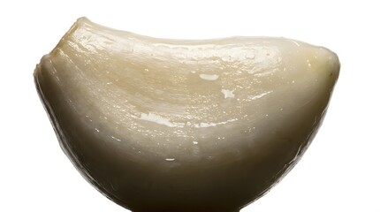 Close-up of a Single Peeled Garlic Clove on a White Background.