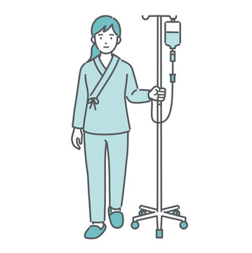 点滴スタンドを押して歩く女性患者（入院着・パジャマ）