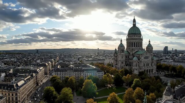 Epic aerial timelapse over Brussels showcasing the historic Royal Church of Saint Mary against a dramatic cloudy sky